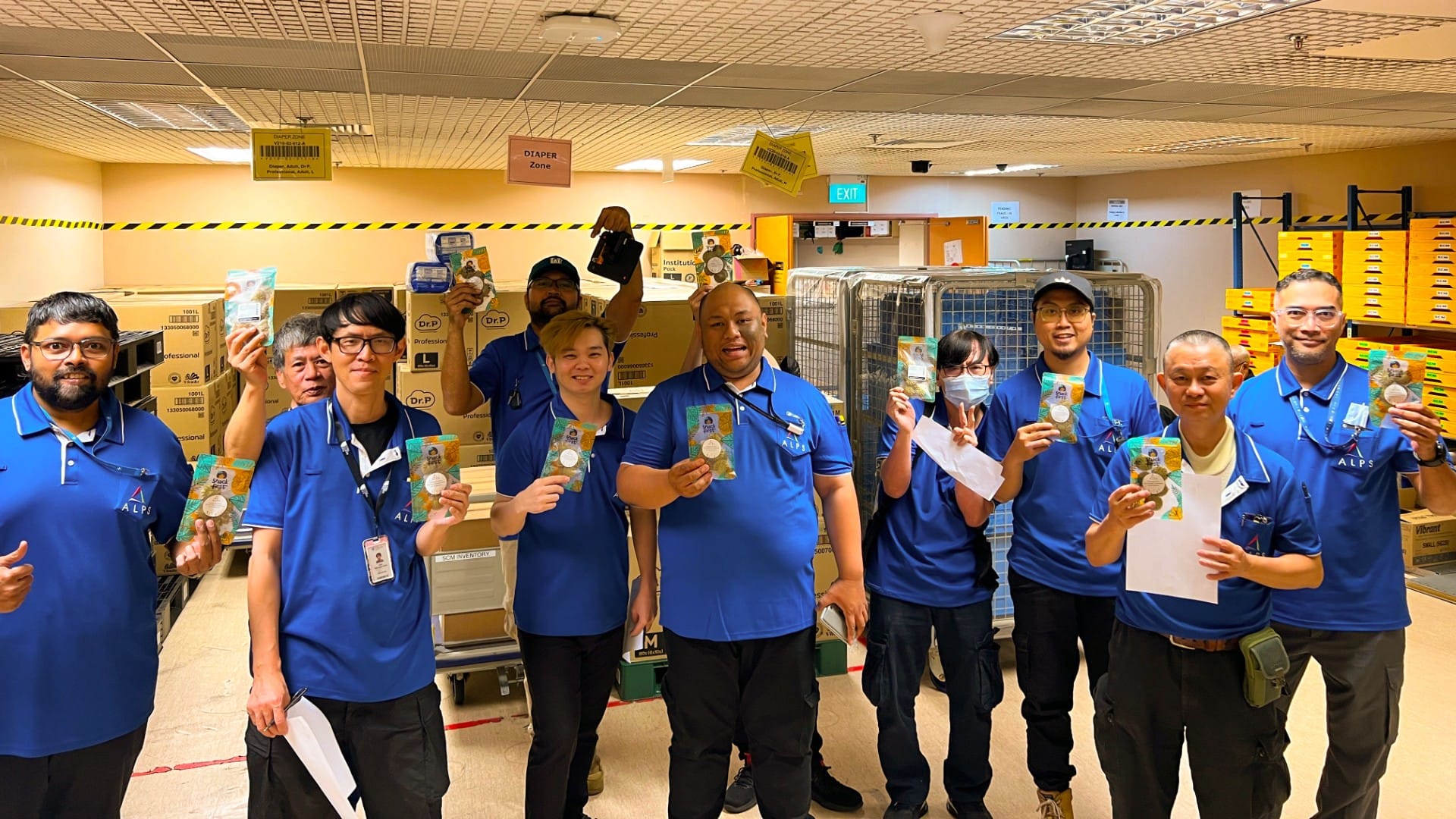 Image of ALPS staff with their Hari Raya festive goodies